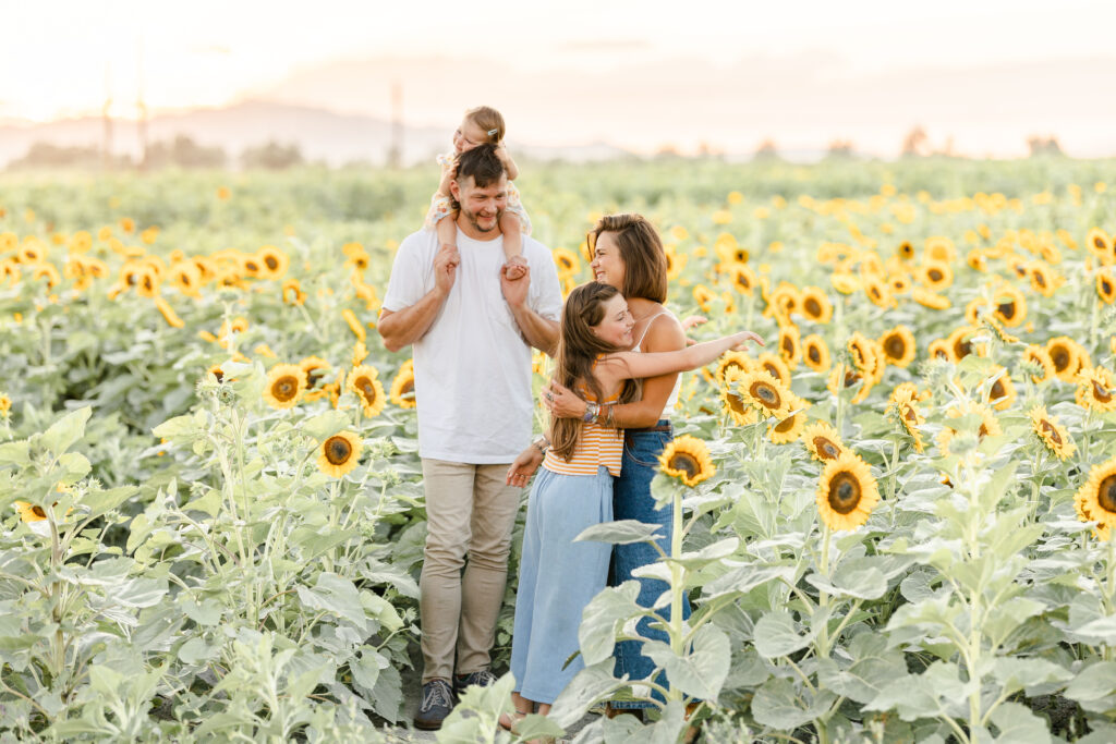 family in sacramento sunflower field