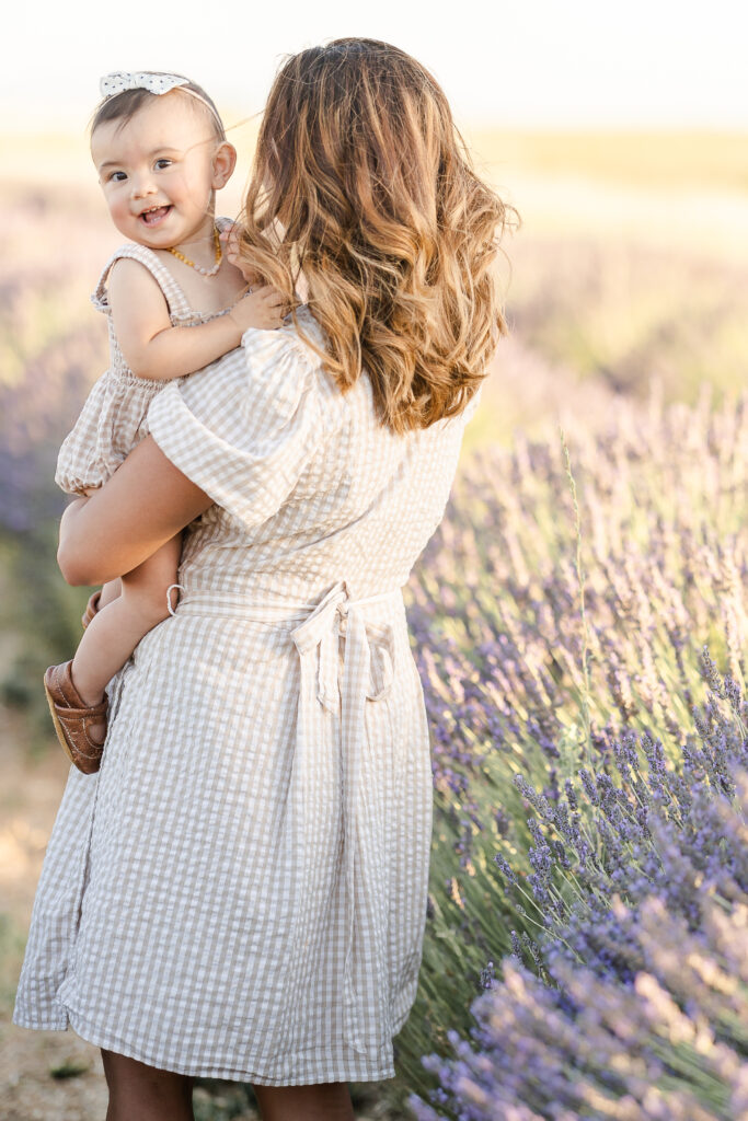 Mother with baby in lavender field captured by a Marin family photographer